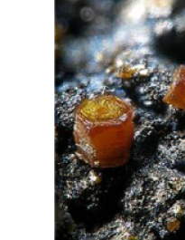 Orange crystals of CdS. This particular crystal is the naturally occurring mineral called “Greenockite” which is CdS with trace amounts of impurity which can change its color somewhat.